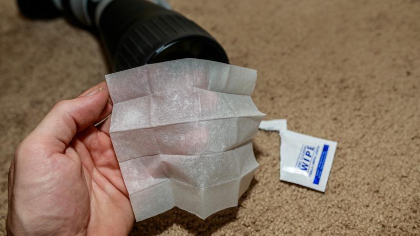 Using wet wipes for cleaning hunting optics