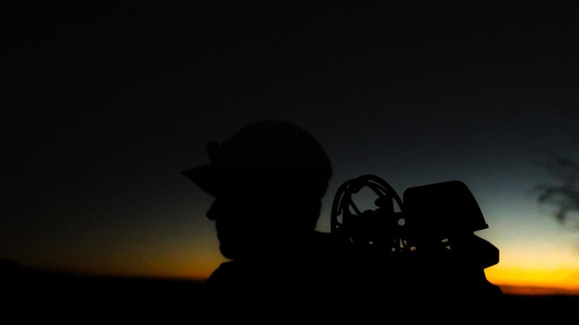 Bowhunter at sunset