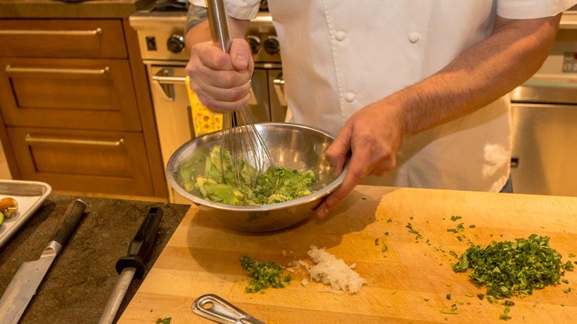 Mashing up avocados for guacamole