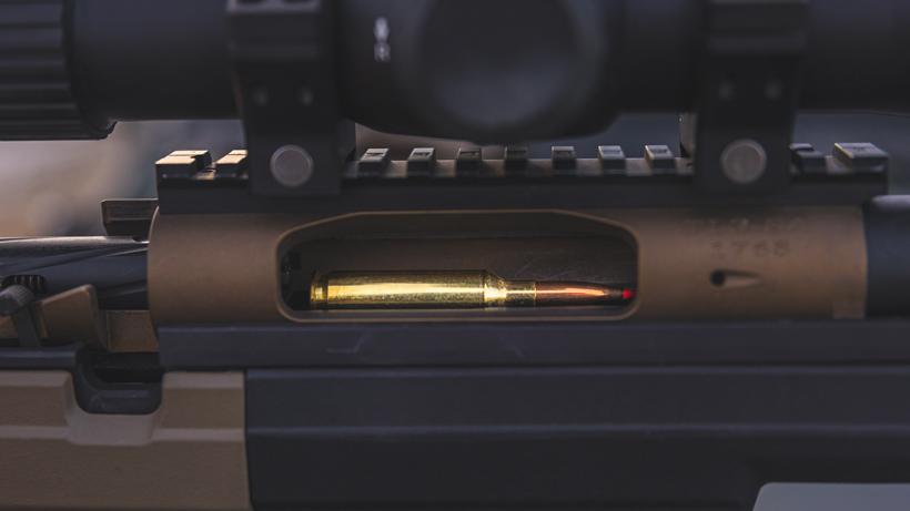 Checking equipment before shooting rifle