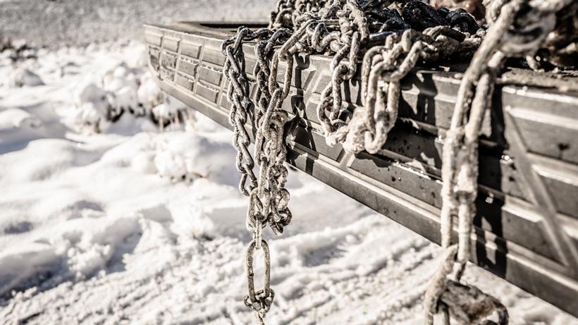 Truck tire chains on tailgate