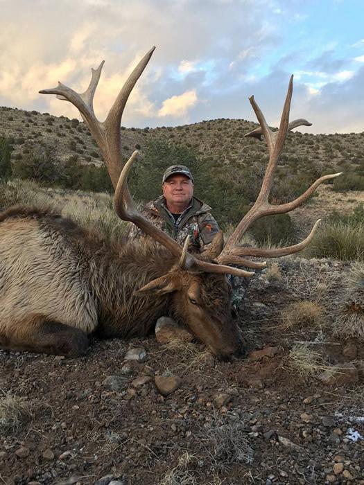 Giant bull elk taken with compass west outfitters
