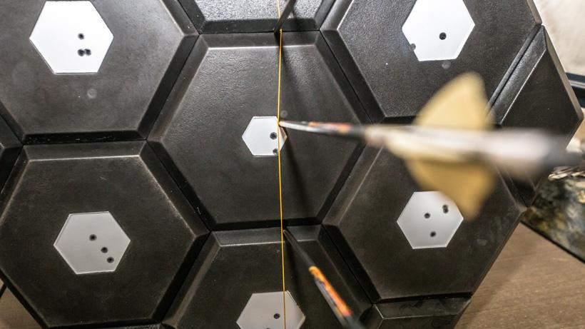 Sighting bow in at close range aiming at string