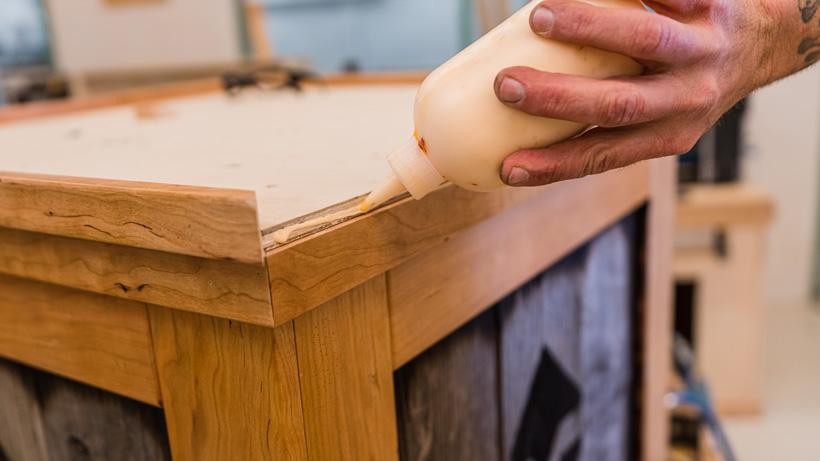 Applying glue to the top trim