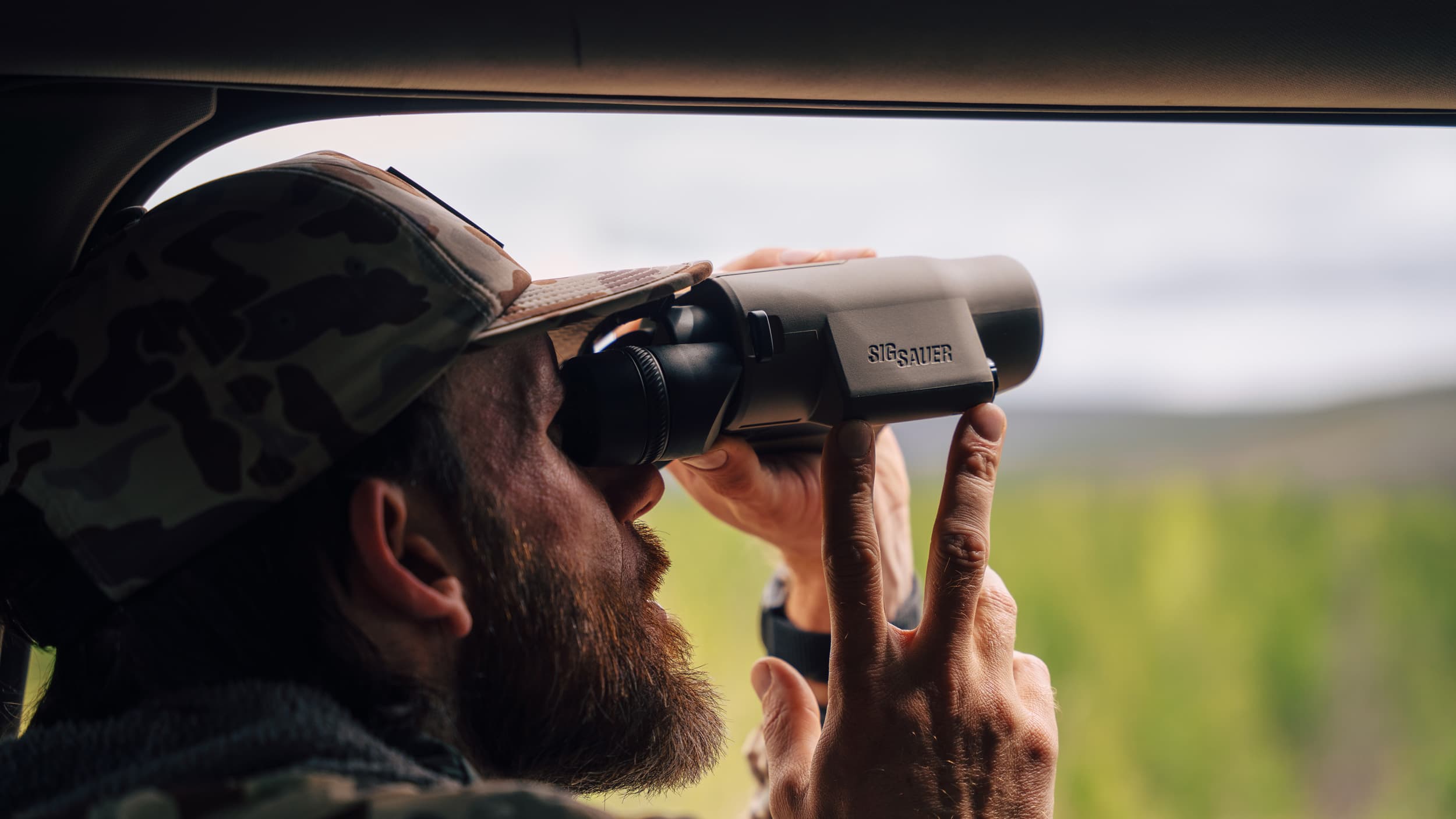 Brady Miller glassing from truck with SIG SAUER ZULU6 HDX PRO 16x42 image-stabilized binoculars