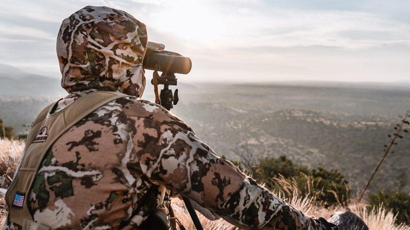 Hunter glassing while sitting in the arizona brush