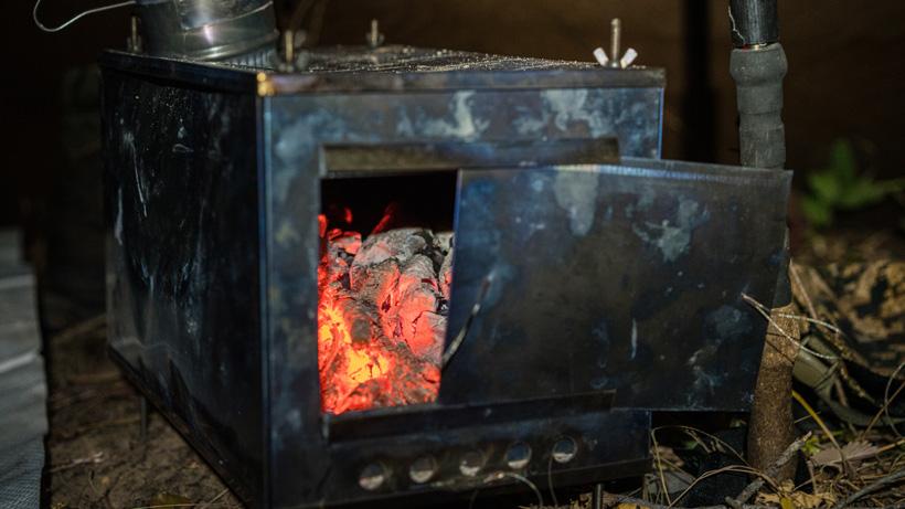 Hot tent stove combo in floorless shelter