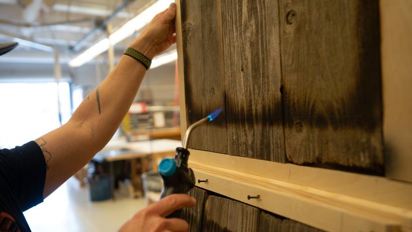 Burning barn wood accents in panels