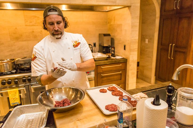 Pressing the elk meat into sausage patties