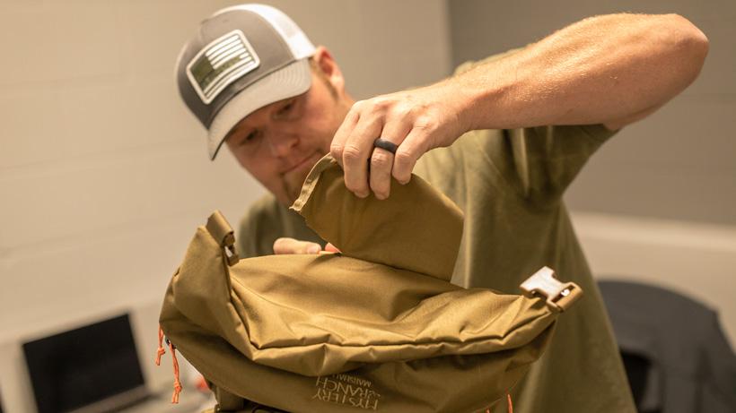Removing fabric on top lid of mystery ranch marshall backpack