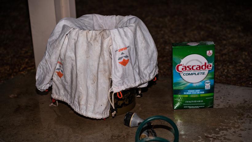 Cleaning game bags in bucket