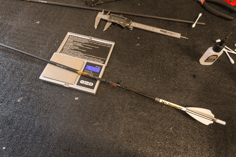 Weigh arrow with vanes