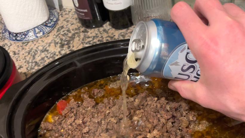 Adding busch light to mule deer chili