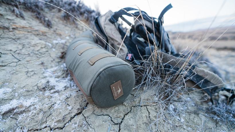 Marsupial gear spotting scope case while hunting