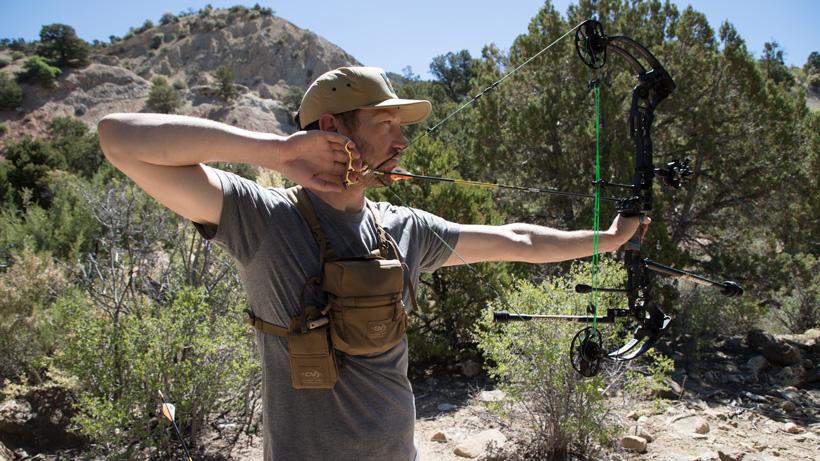 Hunter demonstrating how to draw a right handed bow