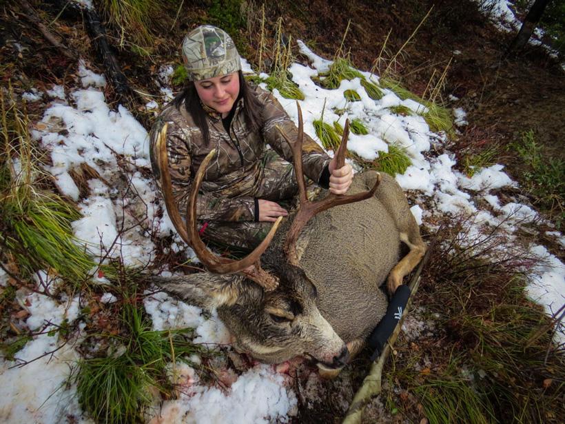 Stephanie Barnett admiring her Montana mule deer