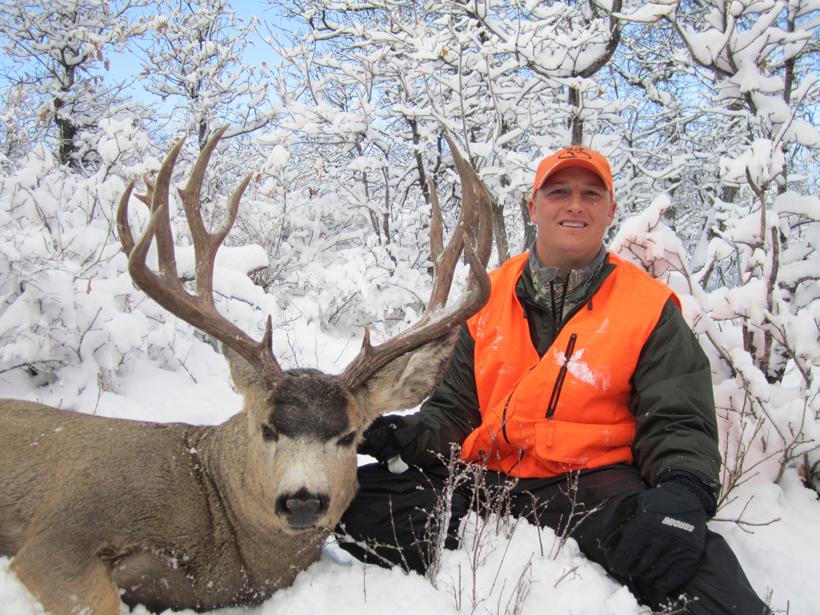 Kody smith with colorado mule deer buck