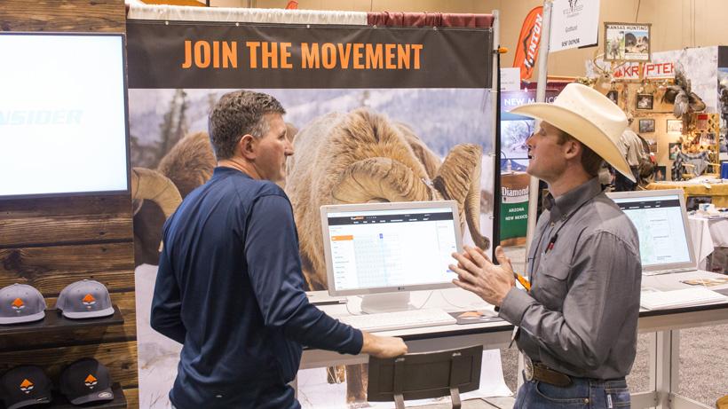 Talking with customers at hunting trade show