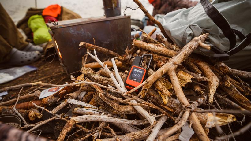 Wood pile in Seek Outside tipi shelter