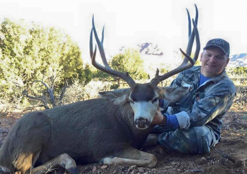 Lonnie with an arizona mule deer buck taken with high point outfitters