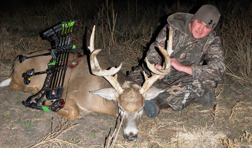 Stephen spurlock with his kansas archery whitetail buck