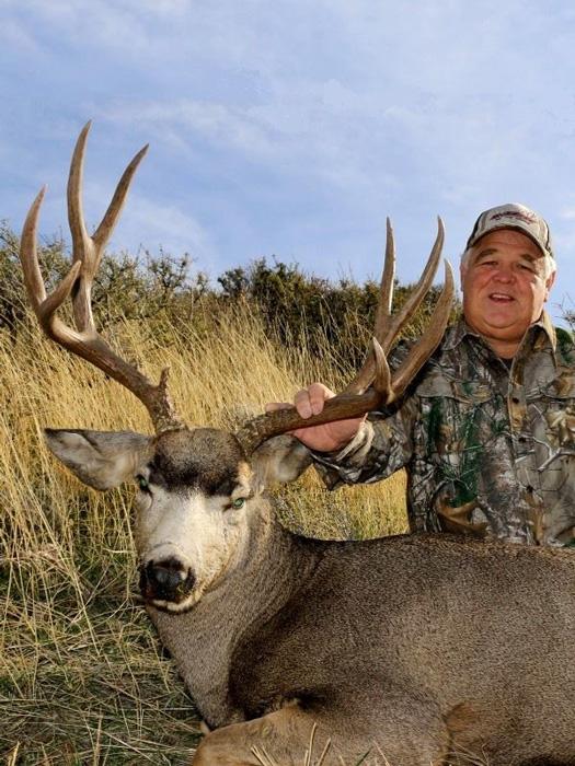 Tyler with an idaho mule deer taken with bearpaw outfitters