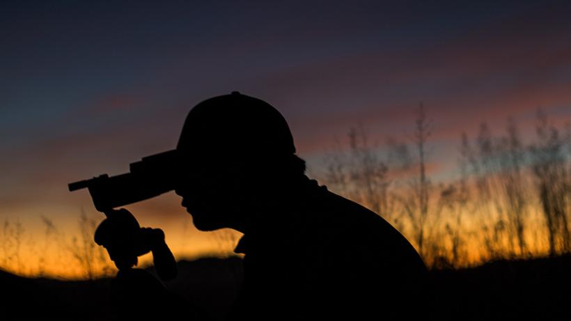 Glassing for coues deer with an arizona sunset