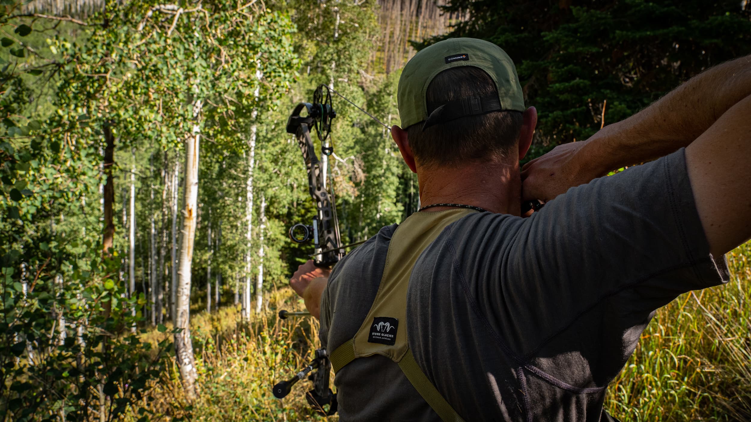 Trail Kreitzer at full draw on archery elk hunt