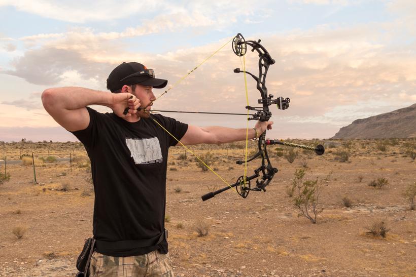 Black bow at full draw