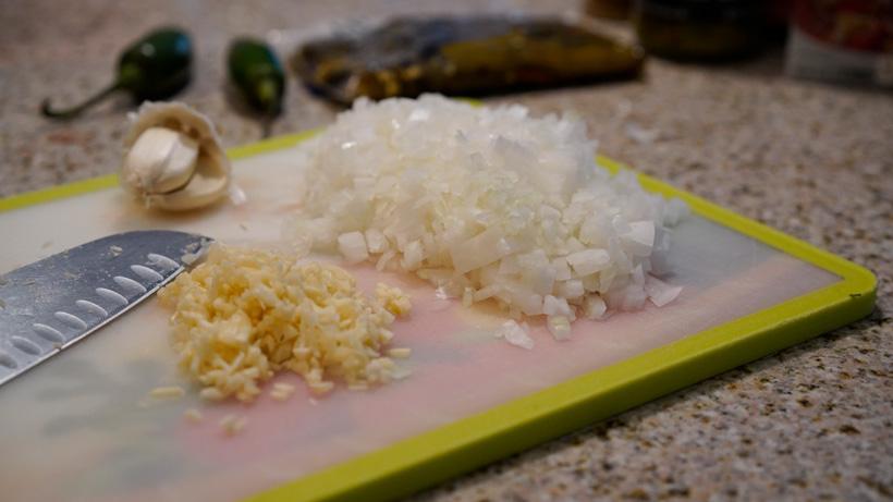 Cutting up onions and garlic