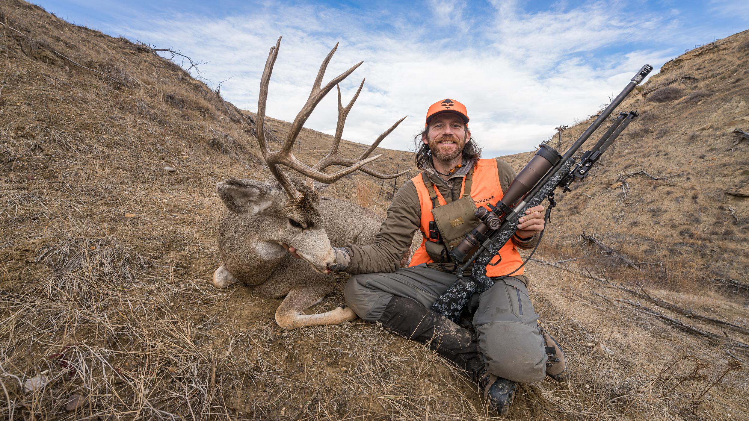 Brady Miller with mule deer buck taken with Browning X-Bolt-2 rifle