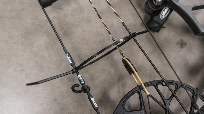 Zip tie on bow string and cables