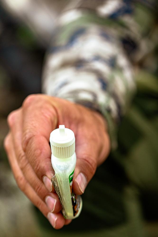 Wind checker on elk hunt