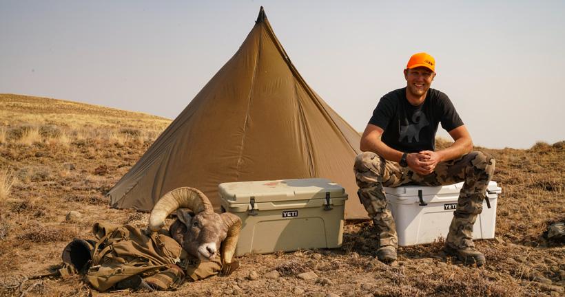 Darrick back at camp with his bighorn sheep