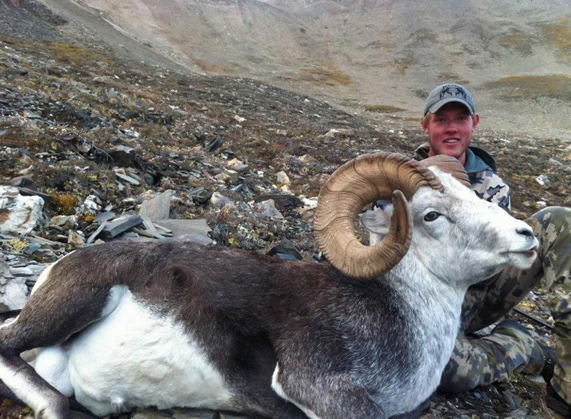 Nathan French with his giant stone sheep