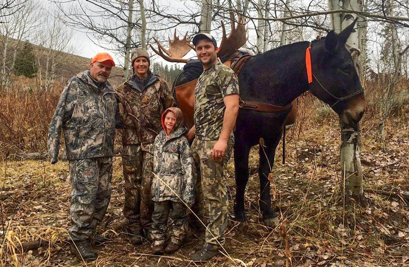All smiles after loading the moose on the mule