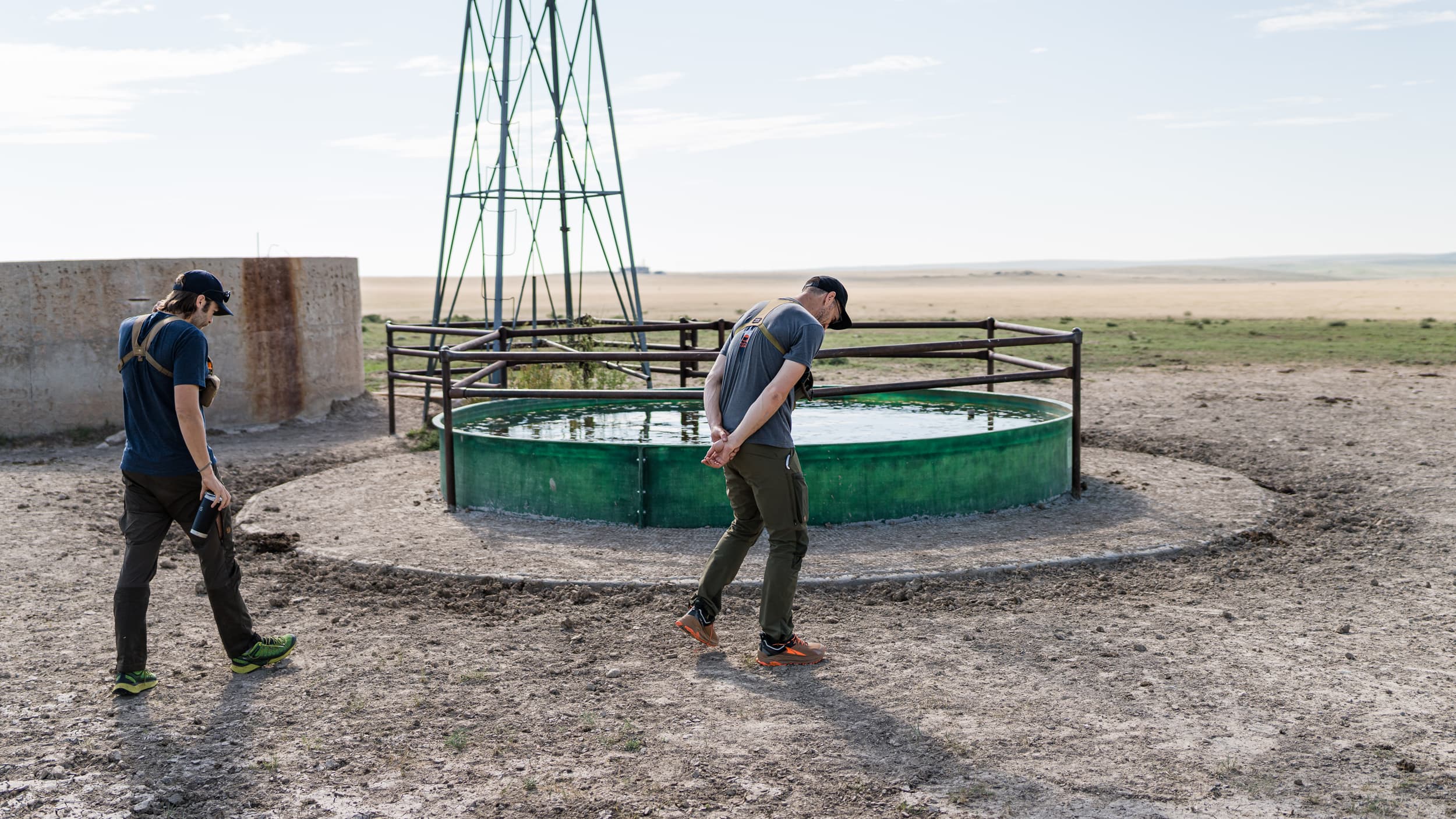 Walking around water tank looking for antelope tracks